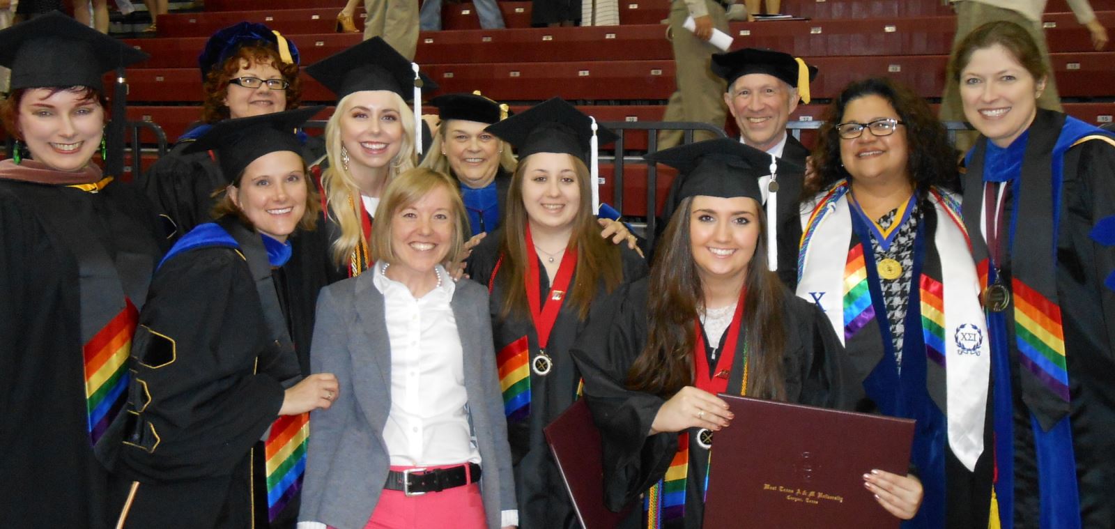 Fine Arts and humanities faculty and students wearing rainbow stoles, May 2015